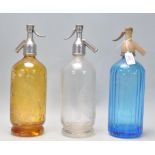 A group of three 1930's vintage advertising soda siphon's to include a blue glass Hooper & Struve
