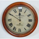 A late 19th / early 20th Century mahogany cased station wall clock having a round face with roman