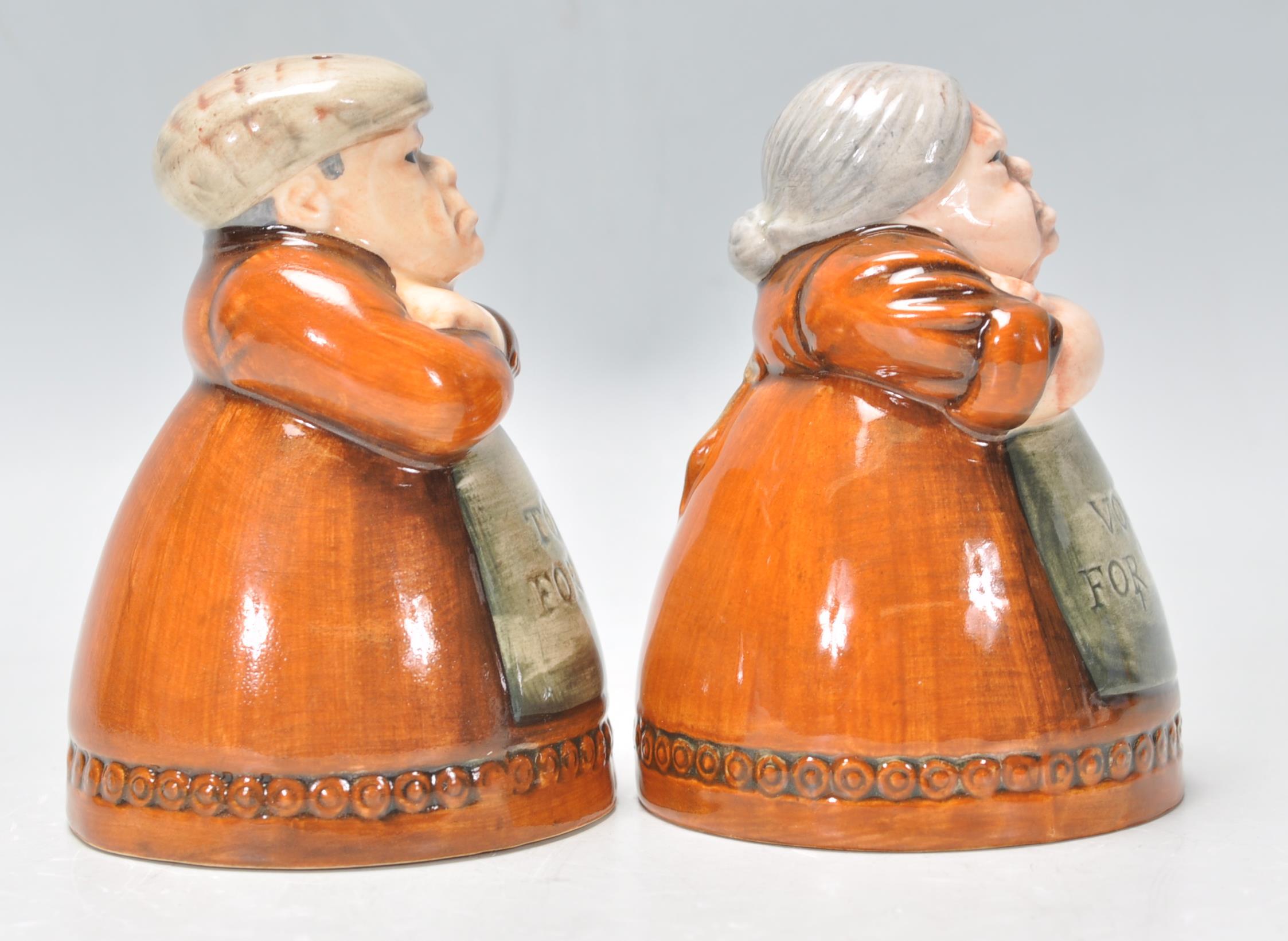 A pair of Royal Doulton salt and pepper pots entitled 'Votes for Women' and 'Toil for Men', D7066 - Image 2 of 7