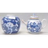 A 19th Century Chinese blue and white tea pot decorated with hand painted precious objects