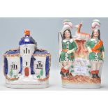 A pair of 19th Century Victorian Staffordshire flat back figurines to include a figurine depicting a