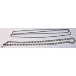 Two long silver necklace chains. One being a snake link example having a spring ring clasp. Measures