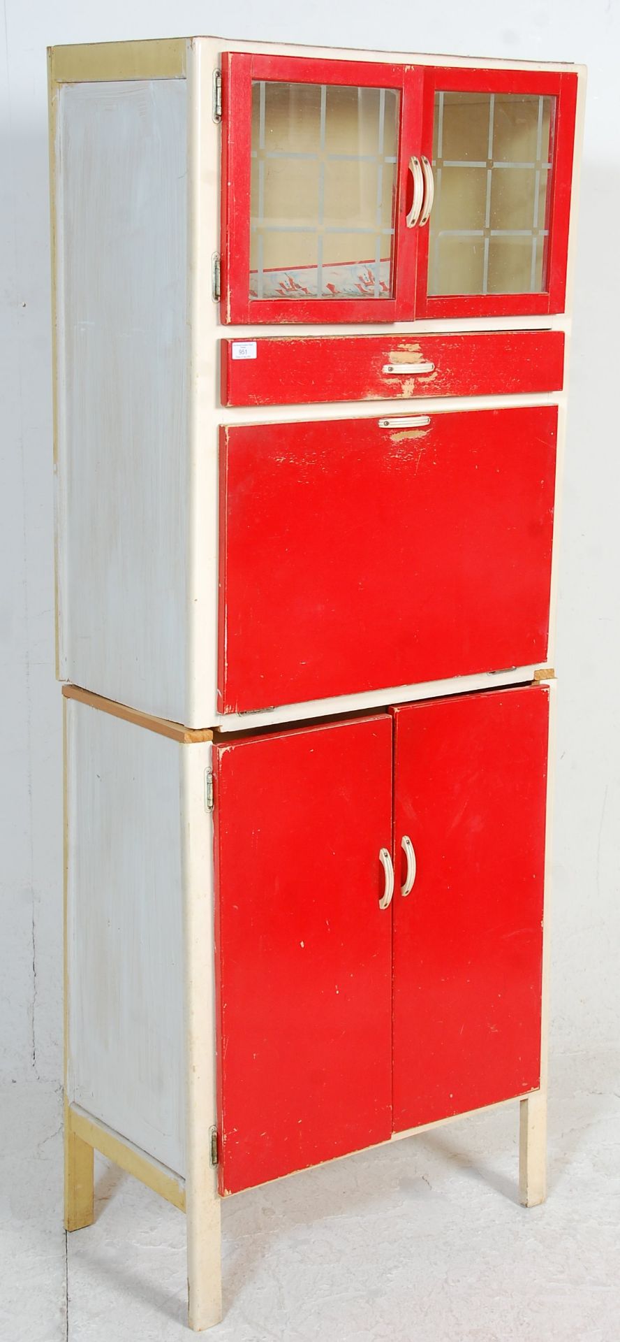 A vintage retro mid 20th Century 1950's kitchen unit having original red and white paint work,