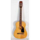 A vintage six string German made 'Florida' half size acoustic guitar having inlaid fretboard and