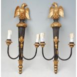 A pair of 20th Century gilt wall mounting candelabra lights having ebonised reeded wall mounts