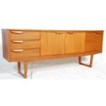 A 1960's retro vintage teak wood sideboard in the manner of McIntosh having the central twin door