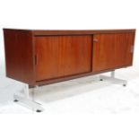 A  mid century Italian sideboard credenza in the manner of Florence Knoll. Raised on chrome supports
