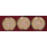 A good group of three Sir Winston Churchill Commemorative £2 coins with each one layered in 18ct