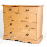 A 19th Century Victorian pine chest of drawers having two over three drawers with dark wood turned