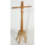 A 19th Century Victorian antique wooden dolly stick having a carved column with handle to the top.