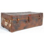 A vintage 20th Century brown leather travel trunk case / coffee table having brass studded with