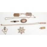 A mixed group of silver jewellery to include a floral brooch set with a pink stone cabochon,