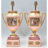 A pair of 19th Century Royal Vienna urn vase lamps having square twin handles and raised on