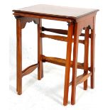 An Edwardian mahogany inlaid nest of two tables of small proportions having rectangular table tops