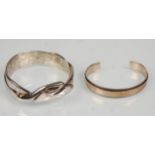 A good heavy 925 silver hallmarked bangle of plain banded form bearing English import marks.