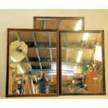 A group of three 20th Century large ex shop / haberdashery display wall mirrors each having carved