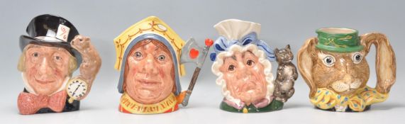 A group of four Royal Doulton ceramic character jugs to include Mad Hatter C6598, The March Hare D