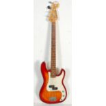 A Grove four string Fender P-Bass style electric bass guitar having a cherry sunburst body with