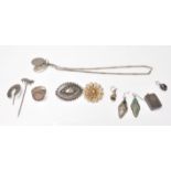 A collection of antique silver jewellery to include a Victorian horseshoe stickpin, a Victorian