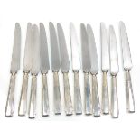 A set of 12 Yates Brothers silver handled knives, having stepped form handles. Each handle