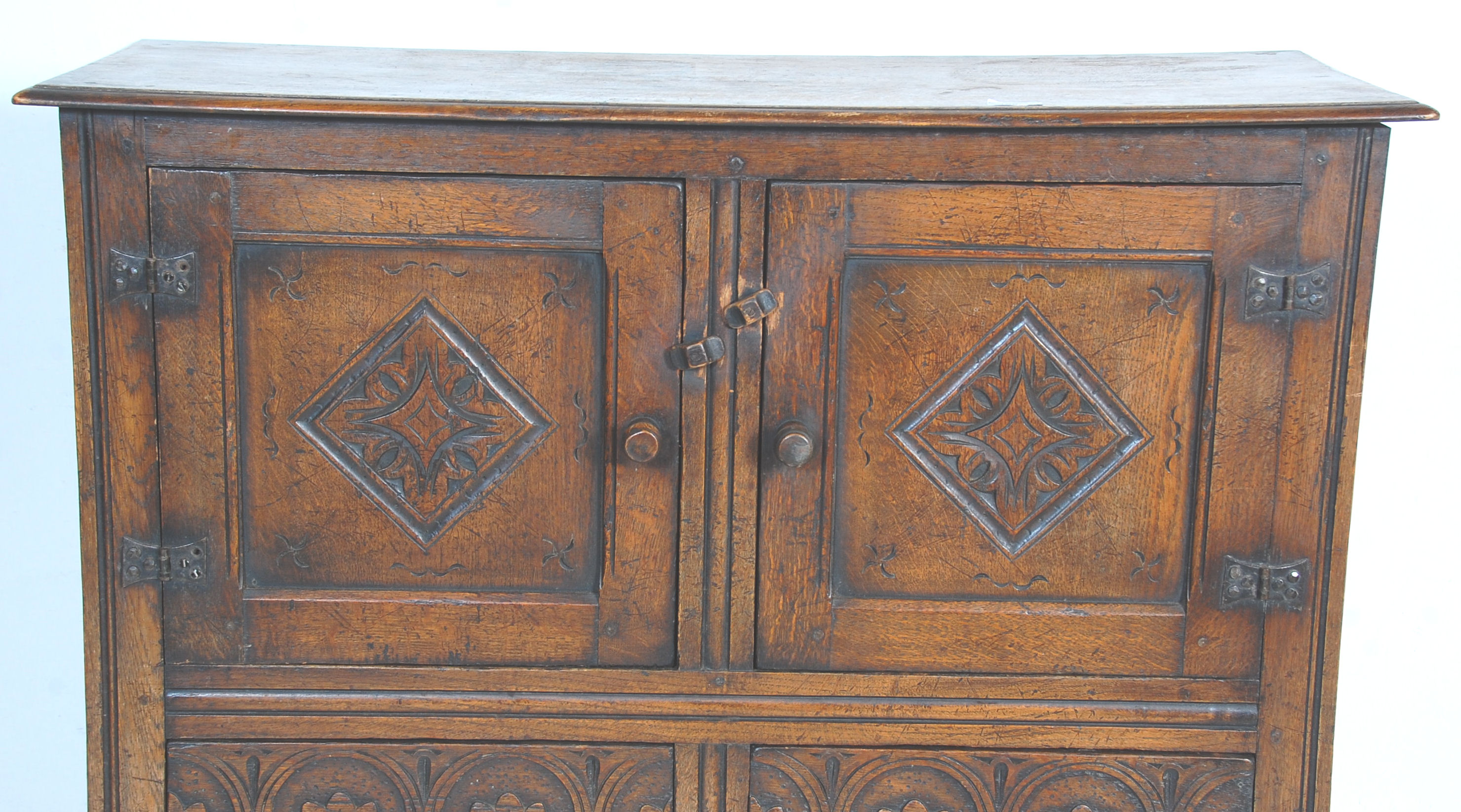 An early 20th Century 1920's carved Ipswich oak cupboard on stand having a twin door cupboard with - Image 3 of 8