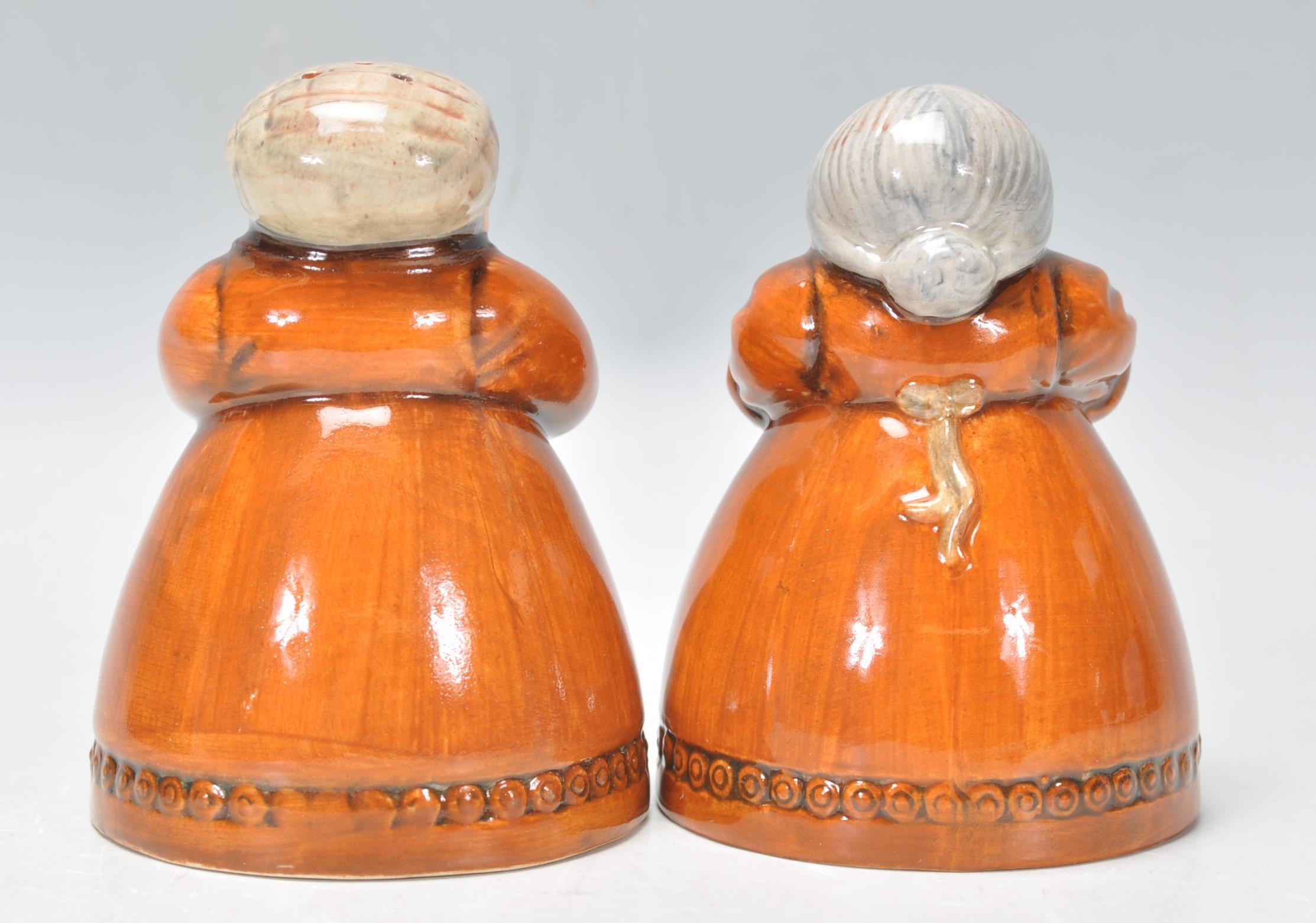 A pair of Royal Doulton salt and pepper pots entitled 'Votes for Women' and 'Toil for Men', D7066 - Image 3 of 7