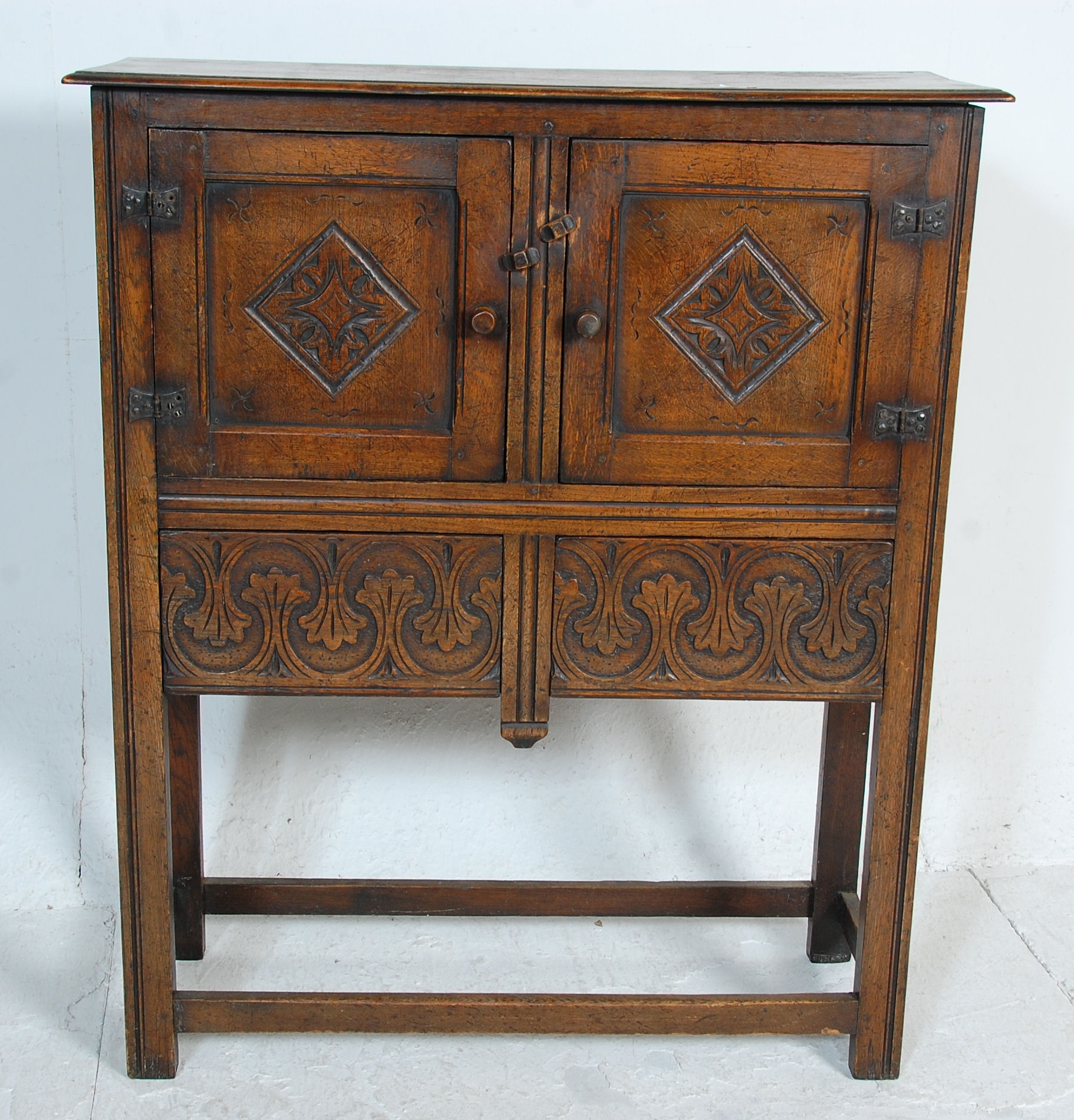 An early 20th Century 1920's carved Ipswich oak cupboard on stand having a twin door cupboard with - Image 2 of 8