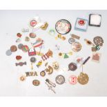 A collection of vintage enamelled and other badges to include military, sporting and advertising.