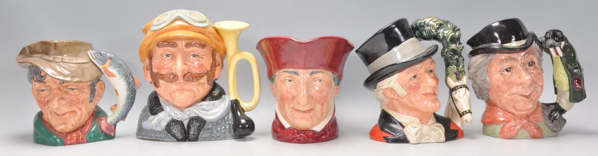 A group of five Royal Doulton character jugs to include The Poacher D6429, The Walrus and