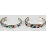 Two handmade sterling silver bangle bracelets having applied semi precious stone decoration. Both