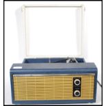 A vintage mid 20th Century Fidelity Solid State record player having a blue case with a grey lid,