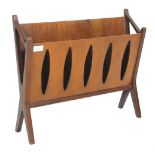 A retro mid century walnut magazine rack  stand. The x-frame supports with returns supporting a