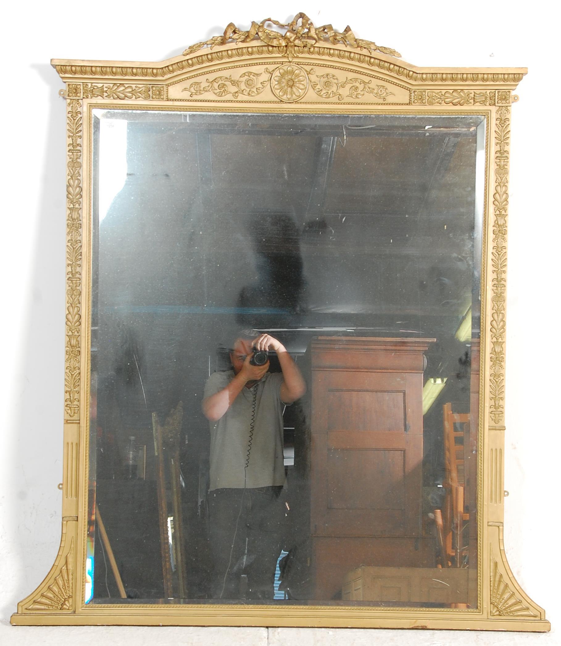 An antique early 19th Century regency wall mirror having a gilt frame with moulded gilt decoration - Image 5 of 6