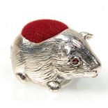 A stamped 925 silver pin cushion in the form of a guinea pig having a red velvet cushion to the