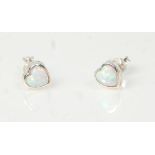 A pair of ladies 20th Century silver stud earrings set with heart cut opals. Weight 1.1g. Measures