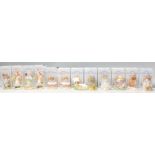 A group of twelve Royal Albert ceramic figures in 'The World Of Beatrix Potter Collection' to