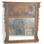 A 19th Century Victorian wall mirror having a wooden frame with gilt moulded edgings and a painted