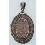 A 19th Century Victorian silver hallmarked locket having engraved swallow decoration and repousse