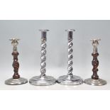A pair of vintage Art Deco chrome candlesticks having barley twist columns and rounded bases.