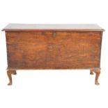 A 19th Century mahogany chest of rectangular form being raised on cabriole feet with ebonised