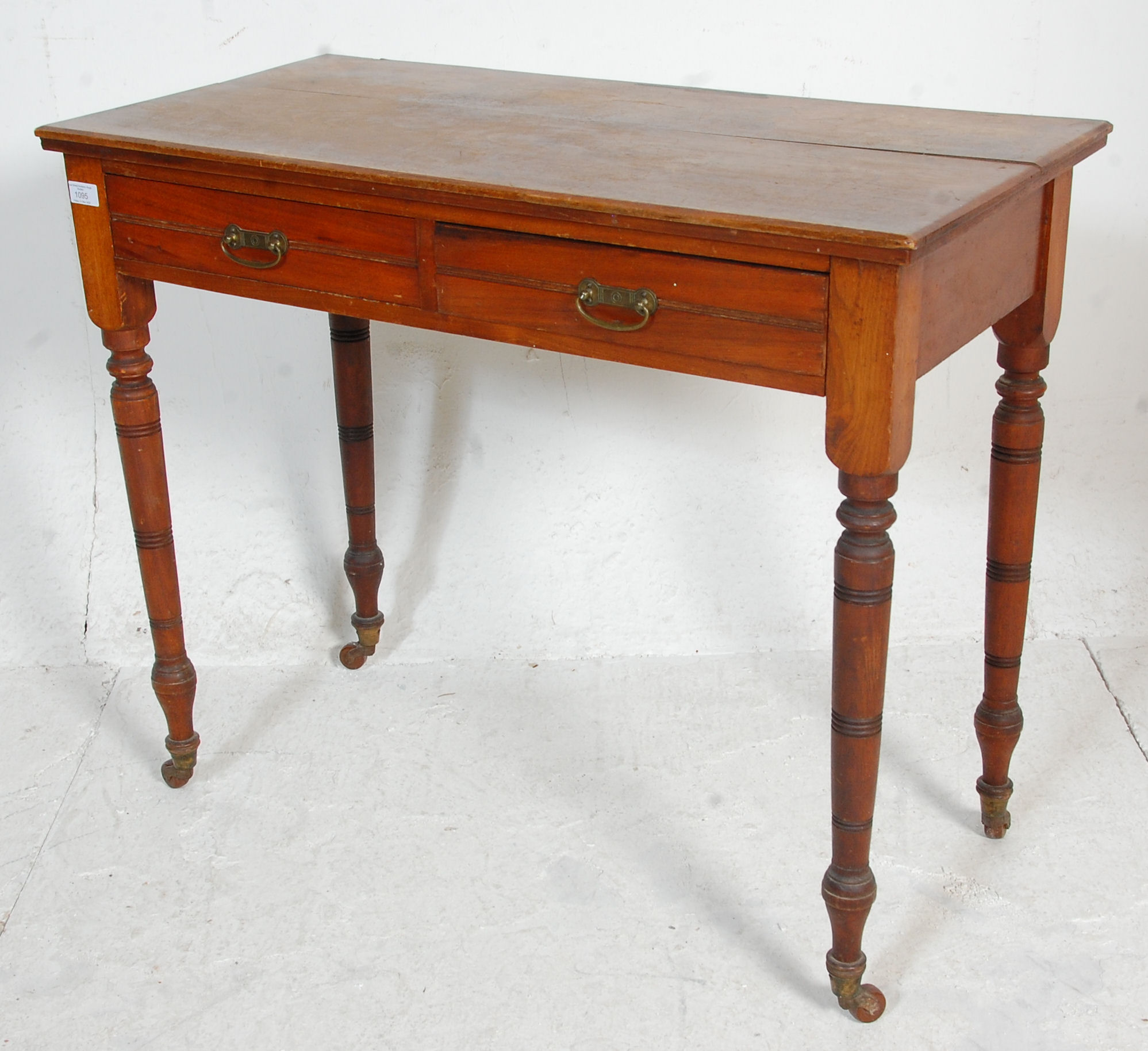 A late Victorian ash / oak writing table desk being raised on turned legs with castors having frieze - Image 4 of 6