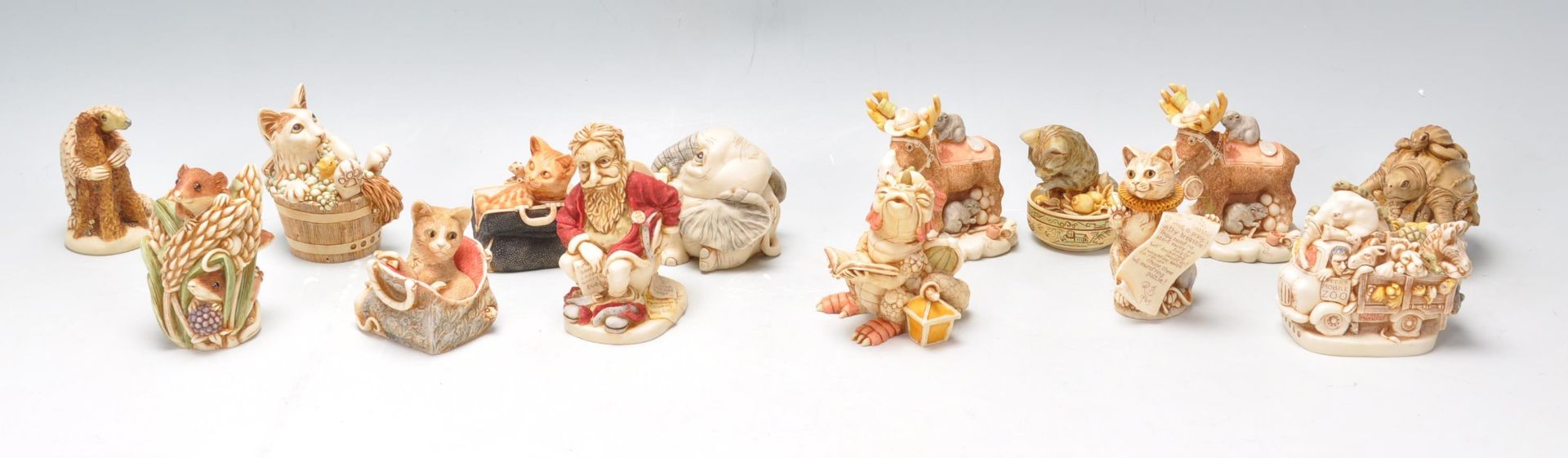 A collection of fifteen resin Harmony Kingdom novelty figurines to include Holy Sit, King Of The