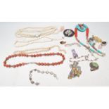 A collection of vintage costume jewellery to include a turquoise and coral collar necklace, two