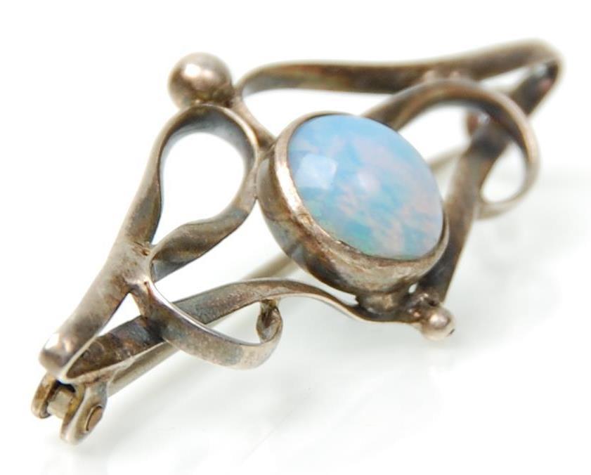 An early 20th Century Art Nouveau silver brooch set with a central opal panel within an openwork - Image 3 of 4