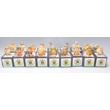 A collection of eighteen Pot Bellys carved resin figures to include builders, policeman, multiple