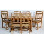 A 20th Century vintage retro Ercol style large extending country kitchen dining table together