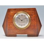 An early 20th Century 1930's  Art Deco oak cased mantel  clock of shaped angular form having a
