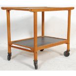 A vintage retro mid 20th Century two tiered drinks / tea trolley being wooden framed with