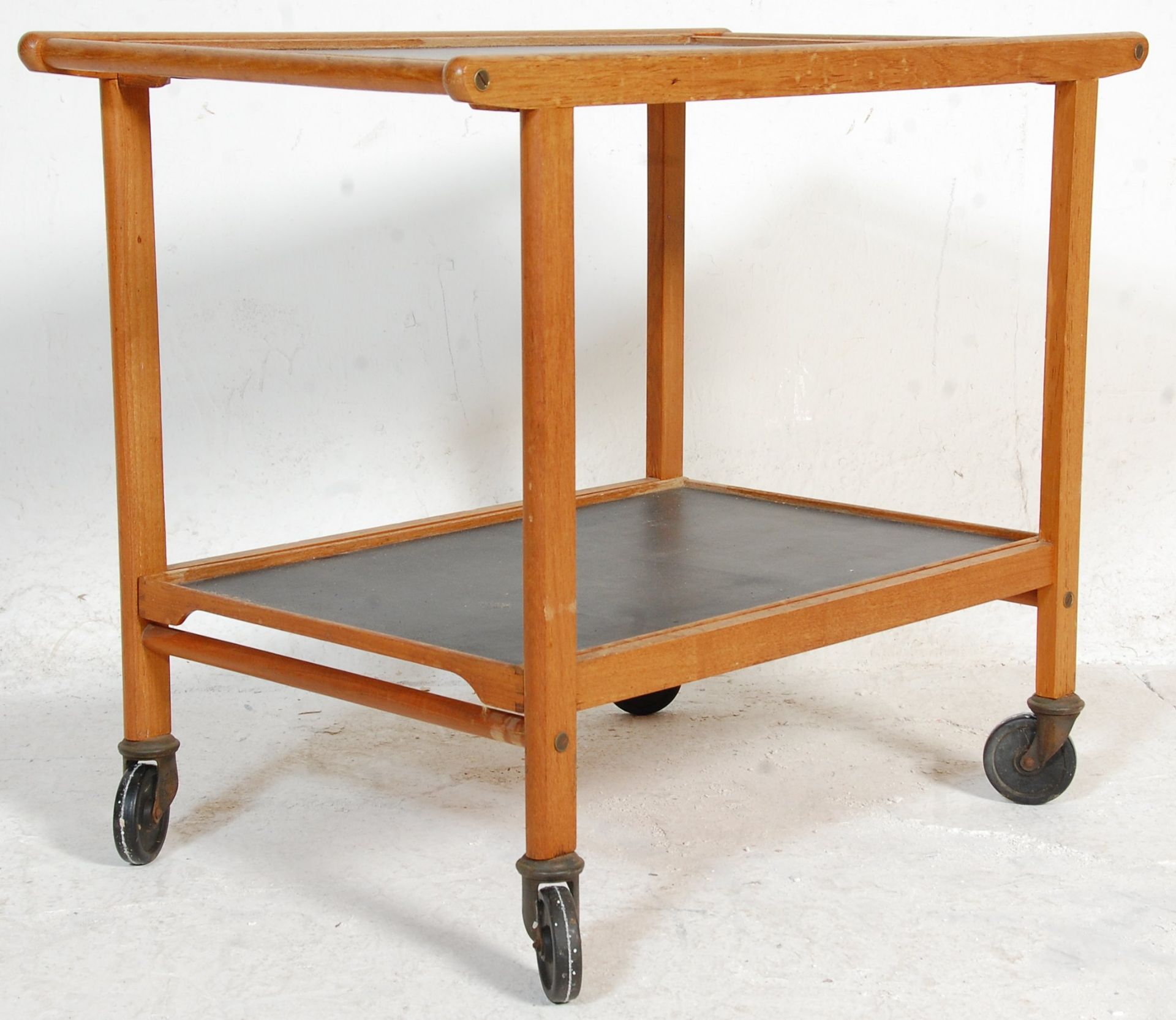 A vintage retro mid 20th Century two tiered drinks / tea trolley being wooden framed with