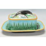 A 19th Century George Jones majolica sardine dish and cover consisting of a square dish with